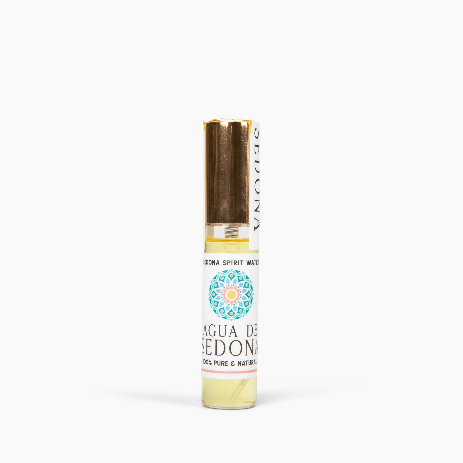 Agua de Sedona natural perfume roller with gold cap and colorful mandala label on white background.