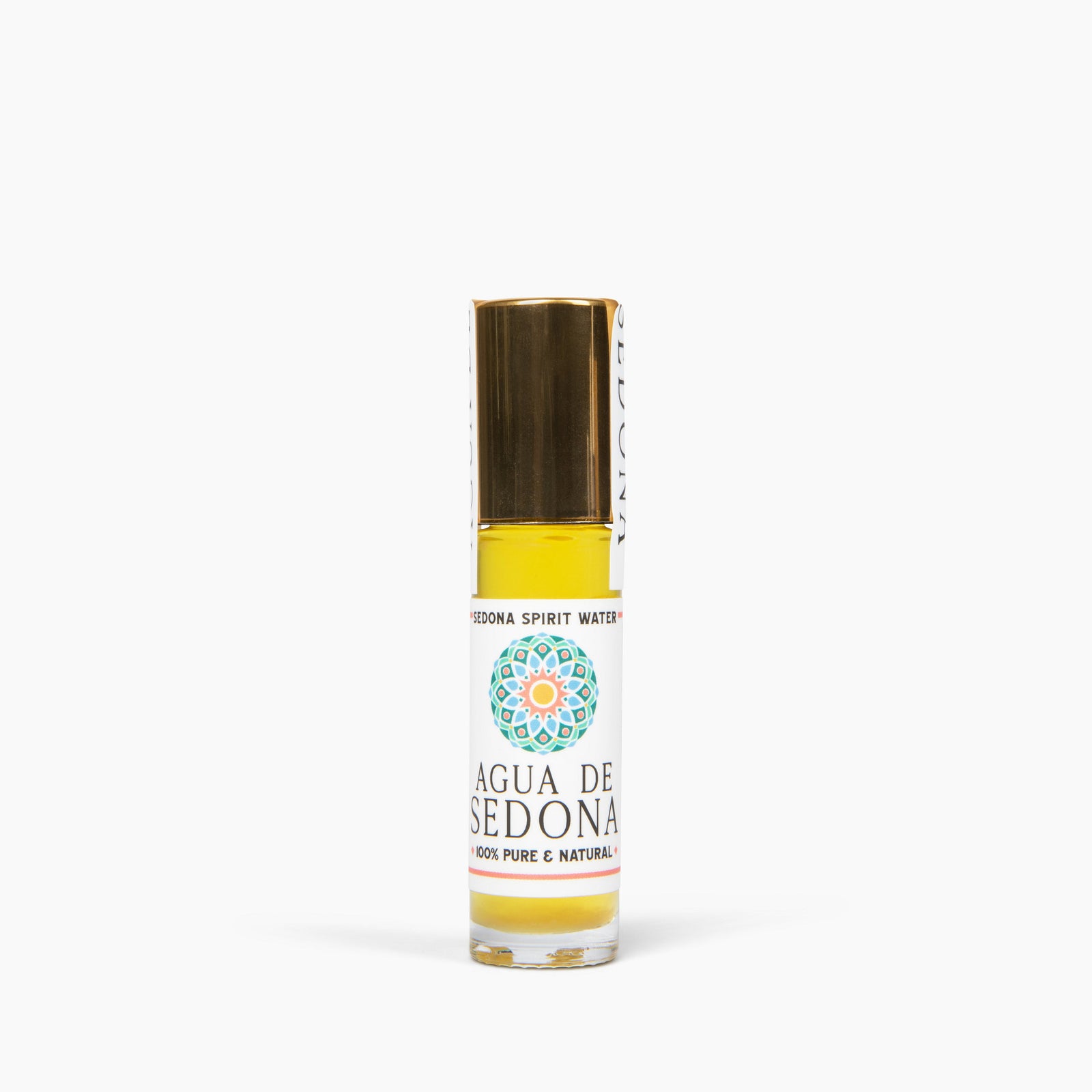 Agua de Sedona roll-on bottle with gold cap on white background, labeled 100% pure and natural.