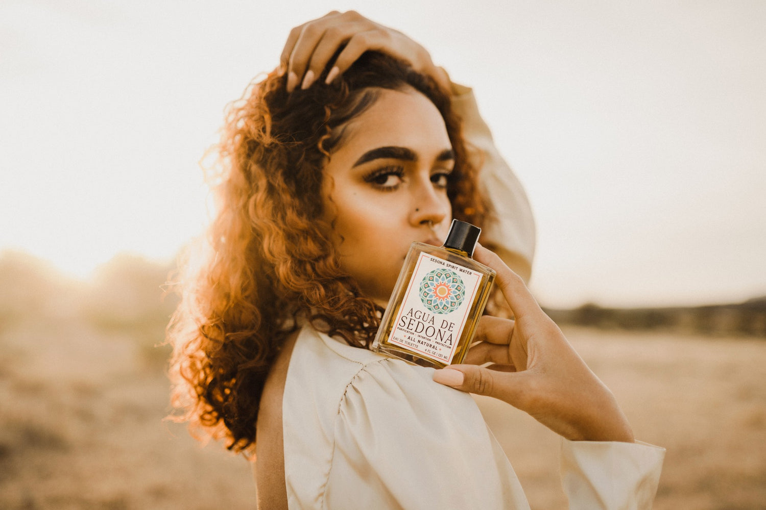 Agua De Sedona All Natural - Girl Holding the bottle