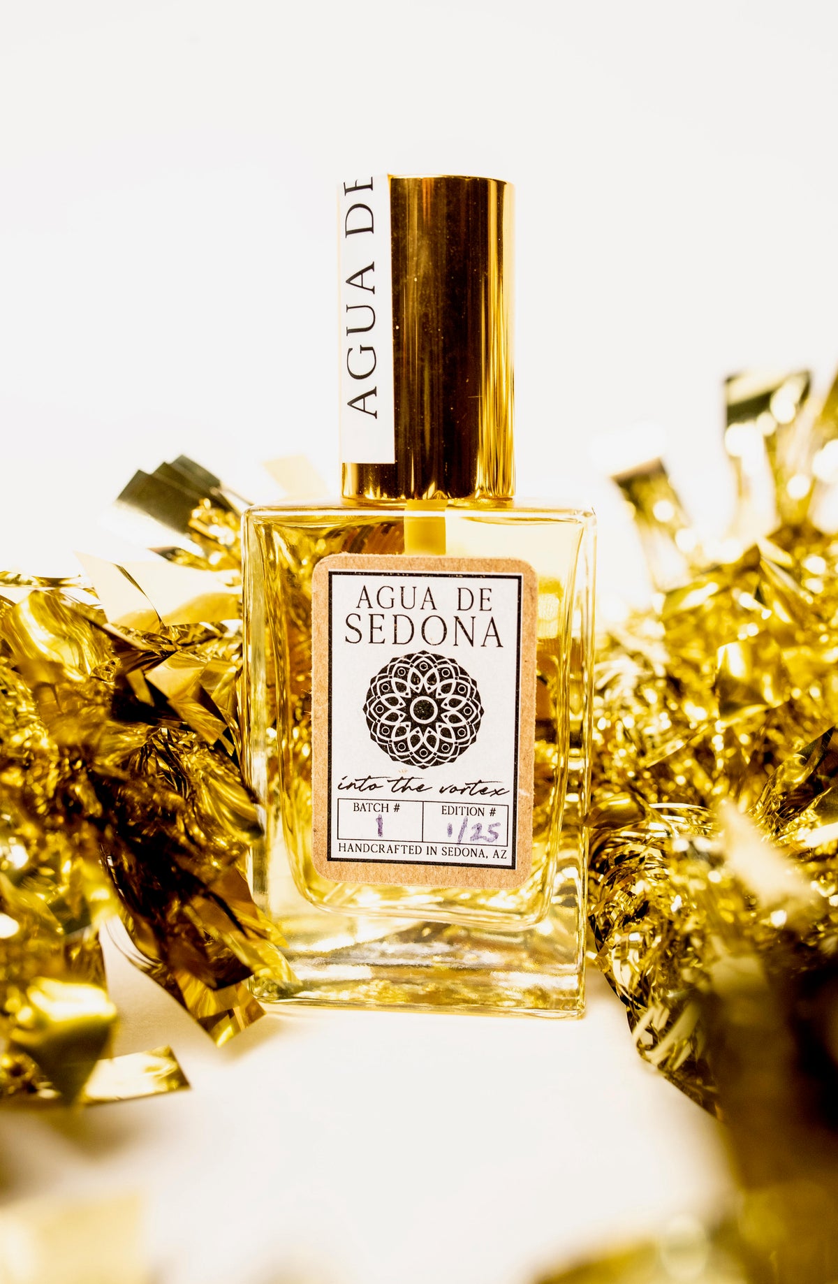 Sedona Spirit Water bottle placed with gold foil paper in the background.